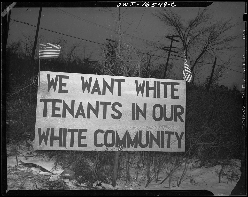 Protestor sign at Sojourn Truth